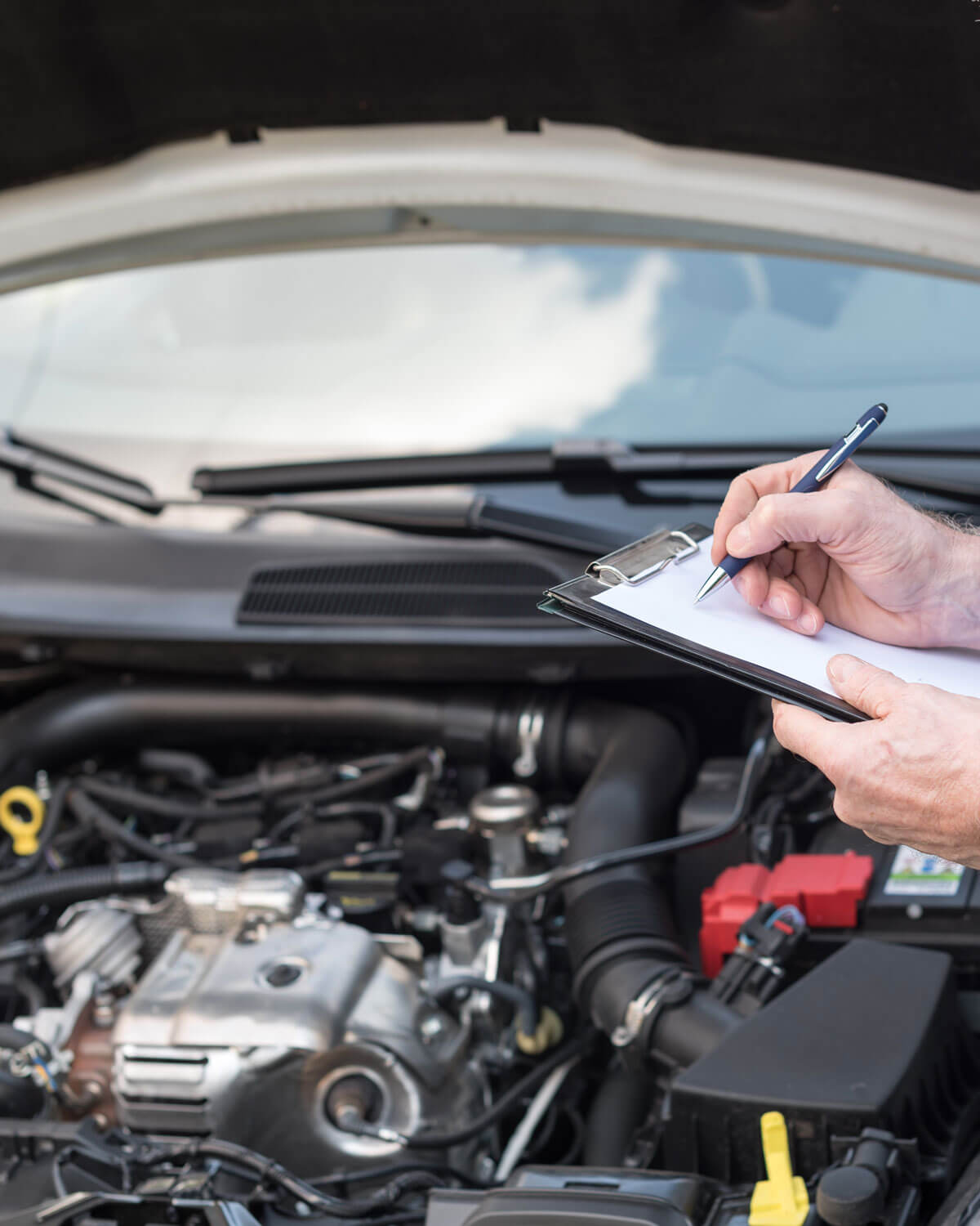 Car Mechanic Checking A Car Engine