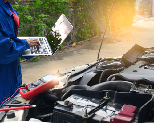 The Auto Repair Technician Is Investigating And Analyzing Car Pr