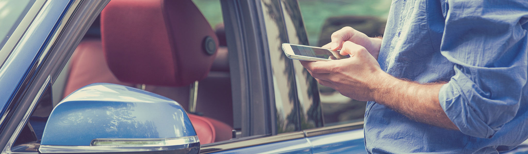 Mobile Phone Apps For Car Owners. Man Using Smartphone To Check